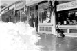 Lots of snow in front of stores